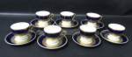 PORCELANA - STEATITA PARANÁ - Sete xícaras para café com seus respetivos pites, em porcelana vitrificada branca, com bordas adornadas com largas faixas sendo na tonalidade azul cobalto, e gravação legitima, generoso filete e friso em pintura à ouro, alças vazadas com vasta douração, marcados no fundo, medindo: xícaras: alt 5,5 cm x diam 6,3 cm/ pires: diam 11,2 cm.