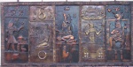 PAINEL, um (1) montado com placa de cobre martelada e relevada com motivos da antiga cultura Egípcia do tempo dos Faraós, fixada sobre madeira, medindo 221 x 109 cm.