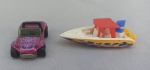 BRINQUEDOS, duas (02) miniaturas: 1 carro Hot Wheels escala 1/64; 1 lancha MatchBox Speedboat 2000 MATTEL; medindo o maior 7,5cm, produzidos de metal e plástico; usados.