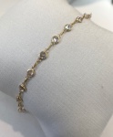 PULSEIRA INFANTIL CONFECCIONADO EM OURO AMARELO 18K, COM ZIRCONIA BRANCA, PESO: 1,2g, TAMANHO: 14cm. VALOR DE MERCADO: R$ 1.000,00