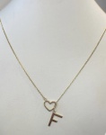GARGANTILHA CARTER CONFECCIONADO EM AMARELO,18K, COM PINGENTE DE CORAÇÃO E A LETRA F, PESO: 3,7g, TAMANHO DA CORRENTE cm, VALOR DE MERCADO: R$ 3.500,00