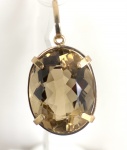 PINGENTE EM OURO AMARELO 18K, COM 1 TOPÁZIO AMARELO NATURAL OVAL DE 20 Cts, PESO: 6,1 GRAMAS.