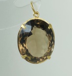 PINGENTE EM OURO AMARELO 18K, COM 1 TOPÁZIO FUME NATURAL OVAL DE 15Cts, PESO: 4,8g, VALOR DE MERCADO: R$2.000,00