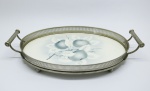 FAIANÇA - Bandeja oval decorada com frutos e galeria em metal espessurado a prata. Med. 8x36x21 cm. Fios de cabelo e trincada.