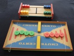 Dois jogos infantis, seleção de cores em caixa de madeira com 13 peças, 33 x 17 cm. e chute certo executado em MDF, falta a bola e o elástico precisa ser trocado 51 x 27 cm.