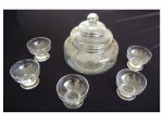 Uma bombonière e 5 taças em vidro translúcido lapidação ramagem, Alt. 24, Diam. 19 cm.