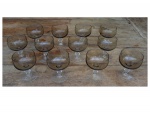 Onze taças para champagne em cristal francês na cor fumê com base translúcida, 11 x 9 cm.