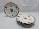 Jogo de 6 pratos rasos em porcelana Real com estampa de pavão e detalhes ouro. Medindo 24,5cm de diâmetro.