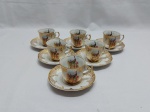 Jogo de 6 xícaras de café em porcelana Real com estampa de pavão e detalhes ouro.