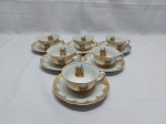 Jogo de 6 xícaras de chá em porcelana Real com estampa de pavão e detalhes ouro.