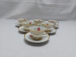 Jogo de 6 xícaras de café em porcelana Real flor rosa, friso ouro, gravado "M.P.".