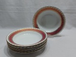 Jogo de 7 pratos fundos em porcelana Steatita, barra vinho com ouro. Medindo 23cm de diâmetro.