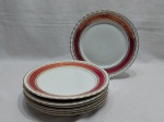 Jogo de 6 pratos rasos em porcelana Steatita, barra vinho com ouro. Medindo 24,5cm de diâmetro.
