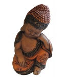 Escultório Filipino em cerâmica decorado com policromia representando infante, assinado na base J.S. Alt. 23 cm.  Este lote encontra-se em Nogueira.
