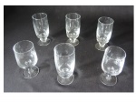 Seis taças para vinho em cristal translúcido em dois modelos distintos, Alt. 14 e 13, Diam. 6 cm. Este lote encontra-se em Nogueira.