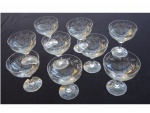 Nove taças para champagne em cristal lapidação folhagens, 1 com lapidação diferente, 12 x 10 cm. Este lote encontra-se em Nogueira, Petrópolis.