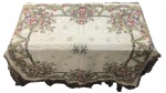 SECULO XX - Fabulosa toalha de mesa em tecido brocado com franja, ricamente adornada com motivo floral em policromia. Marcas do tempo. Mede 1,44 x 144 cm.