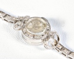 Eloga - Relógio feminino de pulso em platina comtendo 51 brilhantes com lapidação 8/8, peso total 13,9 grs, mede 18 cm. Necessita  revisão.