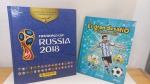 DOIS LIVROS: ÁLBUM FIFA 2018 / LIONEL MESSIE QUADRINHOS. EM BOM ESTADO, ÁLBUM COMPLETO