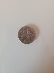 Antiga moeda de dólar comemorativa do bicentenário dos EUA. A  peça  se encontra em perfeito estado de conservação.  Diâmetro: 2,5cm