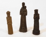 Mão escrava, Brasil século XIX  três imagens votivas duas em jacarandá e outra em madeira clara  medindo a menor 5 cm de altura e a maior 8 cm de altura.