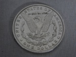 Moeda de 1 dólar em prata 900,  ano 1889, assunto "Morgan Dolllar", bordo serrilhado. SOBERBA, quase flore de cunho. Peso 26.5g.