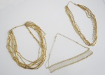 Três colares em metal dourado com fecho com inscrições: ZANCH. Med.: 47cm / 44,5cm / 45cm.