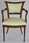 Antiga cadeira com braços e braços em jacaranda com pernas cilíndricas. Med.: 84x45x55cm.
