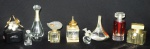 Lote composto por 9 frascos de perfume franceses p/ colecionadores. Menor 6cm. Maior 14cm.