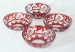 Quatro bowls em overlay na cor rubi, lapidação em baixo relevo com representação da fauna e flora. 1 peça com 2 bicados. Med.: 4,5x11cm.