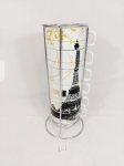 Jogo de 6 Xicaras de Chá em porcelana com cenas  Torre eifell world market  com suporte aço inox Medida: 7 cm x 9 cm