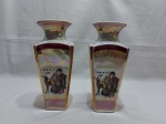 Par de vasos floreiras em porcelana trabalhado com pintura de orientais, furtacor, detalhes ouro. Medindo 22,5cm de altura.