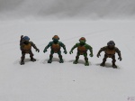 Jogo de 4 bonecos das Tartarugas Ninja, Playmates Toys. Medindo em média 6cm de diâmetro.