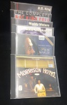 Seis CDs, Morrison Hotel, Bob Marley, John Lee Hooker,Muddy Waters, Nat King Cole., e B.B.King.