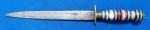 27 - FACA/PUNHAL  RÚSTICO - COMPRIMENTO 24,5 CM - LÂMINA 16 CM - GUARDA EM "CHAPA" - CABO EM ANÉIS DE PLÁSTICO E METAL - ARTESANAL