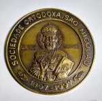 Linda e Grande Medalha - Homenagem dos 100 Anos - 1897-1997 - Sociedade Ortodoxa São Nicolau RJ - Bronze - Efígie do Santo em alto relevo - Medida: 8 cm de diâmetro x 0,6 cm de espessura - Peso: 185 gramas.