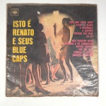 Vinil  Isto é Renato  Renato e seus Blue Caps.  Produto Original. Gravadora CBS. Fabricado e distribuído por CBS Eletronica Brasileira S. A. 1965. Capa (desgastes do material, escurecida e com pontos de oxidação)/contracapa (com desgastes do material, pontos de oxidação, escurecida e com assinatura) em regular estado de conservação, danificada nas bordas colada com fita adesiva, manchas/pontos de oxidação, marcação do disco, com sinais de uso, manuseio e desgastes. Não contém plástico de proteção do disco. Disco com riscos, mesmo que superficiais podem ocasionar algum nível de ruído na audição. Não contém encarte. Selo fonográfico com assinatura. Lado A  6 faixas; Lado B   6 faixas.