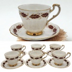 PARAGON - Conjunto vintage de jogo de chá, modelo "Elegance", Conjunto contendo seis xícaras com seus respectivos pires. Decorada em frisos e folhas cor de vinho. Confeccionadas em  fina porcelana Inglesa.