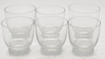 CRISTAL - Conjunto de seis copos de água em cristal, com base decorada em relevos de esferas.