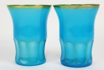 BACCARAT - MODELO GONDOLES LAPIDAÇÃO COTTES PLATES. PAR DE ROBUSTOS GOBLETS EM OPALINA AZUL REMATADA EM OURO. TERÇO INFERIOR LAPIDADO A TODA VOLTA COM PADRÃO COTTES PLATES  REALÇADO EM OURO.  VIDE NOS CRÉDITOS EXTRAS DESSE LOTE IMAGEM DO CATÁLOGO DA MANUFATURA COM A DEMONSTRAÇÃO DO MODELO. FRANÇA, SEC. XIX. 13,5 X 10 CM