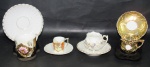 PORCELANA, Quatro xícaras de coleção com seus respectivos pires em porcelana esmaltada na tonalidade branca, de modelos e decorações distintas em policromia. 1 com bicado na borda, todas apresentam falhas na douração. Med.: Maior: 6x6,5x9cm / Menor: 4x5,5x4cm.