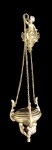 ARTE SACRA, Turíbulo confeccionado em bronze polido e metal dourado, suspenso por trio de correntes fixadas em escultura representando anjo, ricamente cinzelada por concheados e elementos vegetalistas. Med.: 56,5cm.