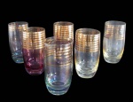 VIDROS, Seis copos para água em vidro nacarado em tonalidades distintas, corpo decorado com faixas em ouro, falhas na douração. Med.: 13,5x6,5cm.
