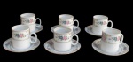 RENNER, Medaillon, Seis xícaras para café com seus respectivos pires em porcelana esmaltada na tonalidade branca, pintura de flores, folhagens e arabescos em policromia e interior filetado a ouro. Med.: 5,5x7x5cm / 10cm.