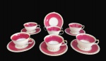 PRINCESS, China, Seis xícaras para chá com seus respectivos pires em porcelana esmaltada na tonalidade creme, decorado com espessa faixa na tonalidade vinho, borda torcida filetada a ouro. 4 xícaras bicadas e 3 pires. Med.: 6x12x10cm / 15cm.
