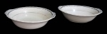 GRINDLEY, Inglaterra, Saladeira e travessa oval funda em faiança vitrificada, borda ondulada, espessa faixa em prata. Travessa oval possui trincado. Med.: 6x21cm / 6,5x23x18cm.