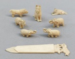 MARFIM, oito (8) esculturas miniaturas variadas e outro: 4 representando elefante; 1 representando cachorro; 1 representando urso; 1 representando leão e 1 marcador de livro com extremidade entalhada na forma de leão estilizado, pequenos defeitos, medindo a maior peça 9,5 cm comprimento, vide foto.