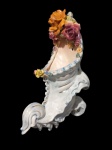 FAIANÇA, Floreira de parede no feitio de cornucópia em faiança europeia vitrificada, ricamente decorada em policromia com flores e folhagens em relevo. Apresenta discretos bicados. Med.: 29,5x11cm.