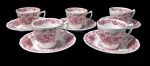RIDGWAY, STAFFORDSTIRE, England, Cinco xícaras para café com seus respectivos pires em faiança inglesa com pintura de florões, flores e folhagens na tonalidade rosa. Apresenta craquele. Med.: 6x9x7cm / 13,5cm.