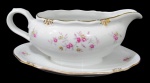 WINDSOR, Bavaria, Molheira fixada a presentoir em porcelana esmaltada na tonalidade branca, com pintura de flores e folhagens em policromia e realces em ouro. Med.: 9,5x21x8cm.